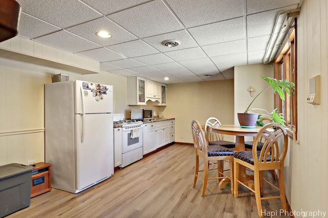 1415 Arabian Spur, Mchenry, IL 60051 - kitchen with white appliances, light wood-style floors, glass insert cabinets, recessed lighting, and white cabinets