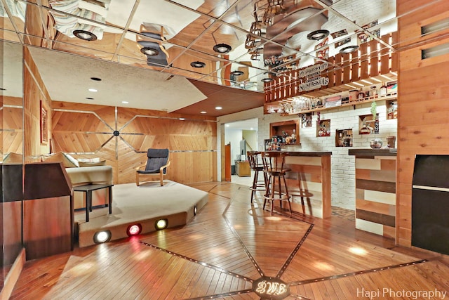 1415 Arabian Spur, Mchenry, IL 60051 - dining room with wooden walls, wood-type flooring, and a towering ceiling