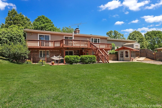1415 Arabian Spur, Mchenry, IL 60051 - rear view of property featuring a deck, a fenced backyard, a chimney, stairway, and a storage unit