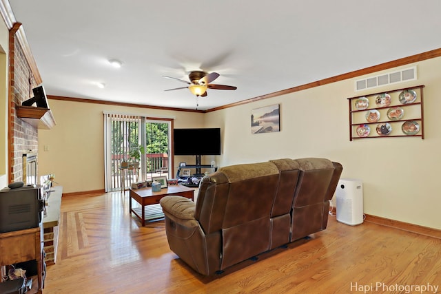 1415 Arabian Spur, Mchenry, IL 60051 - living room with ceiling fan, a brick fireplace, crown molding, and light wood-style flooring