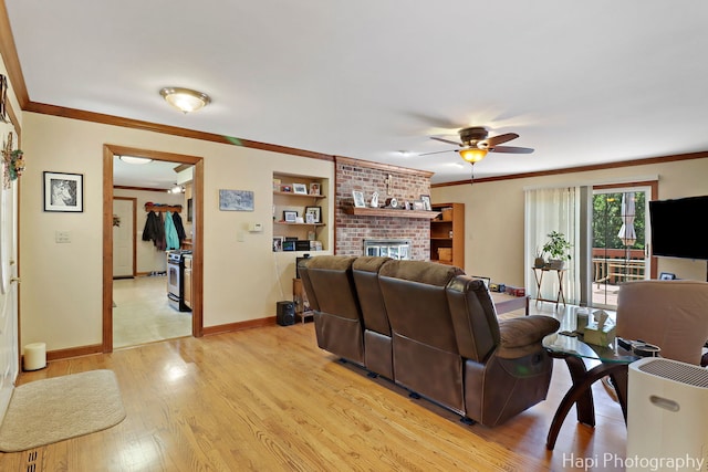 1415 Arabian Spur, Mchenry, IL 60051 - living room featuring ornamental molding, ceiling fan, light wood-type flooring, and a fireplace