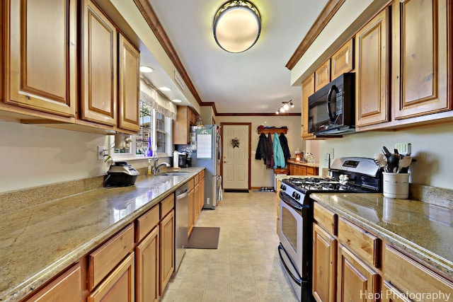 1415 Arabian Spur, Mchenry, IL 60051 - kitchen featuring stainless steel appliances, brown cabinets, light stone counters, and ornamental molding