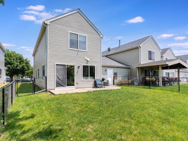 2455 Hillsboro Ln, Montgomery, IL 60538 - rear view of house featuring a gate, a fenced backyard, and a patio