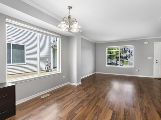 2455 Hillsboro Ln, Montgomery, IL 60538 - spare room featuring crown molding, a chandelier, and dark wood finished floors
