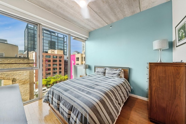 630 N Franklin St Unit 618, Chicago, IL 60654 - bedroom with wood finished floors and baseboards