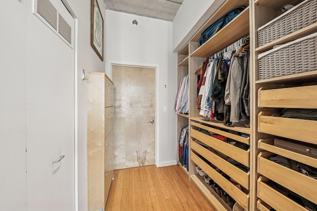 630 N Franklin St Unit 618, Chicago, IL 60654 - walk in closet featuring wood finished floors