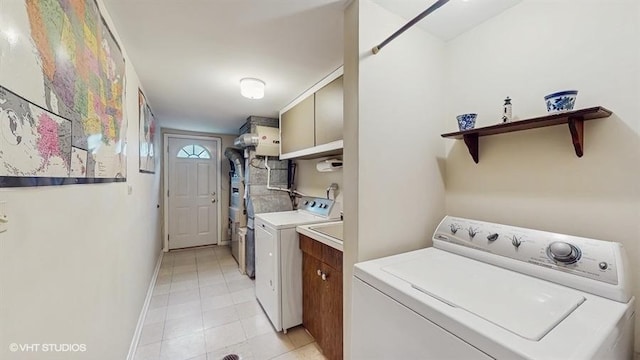416 S Royal Ct, Palatine, IL 60067 - laundry area with cabinet space, washer and clothes dryer, light tile patterned flooring, and baseboards