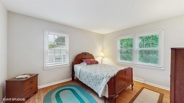 416 S Royal Ct, Palatine, IL 60067 - bedroom with light wood-style floors and baseboards