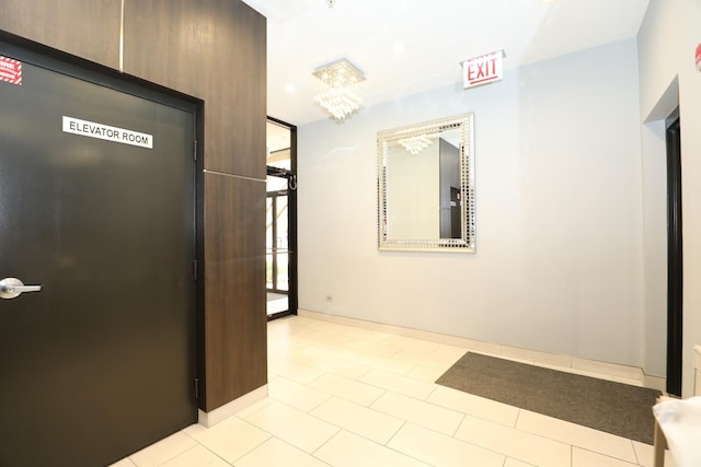 4330 N Neva Ave Unit 411, Norridge, IL 60706 - corridor featuring tile patterned floors and a chandelier