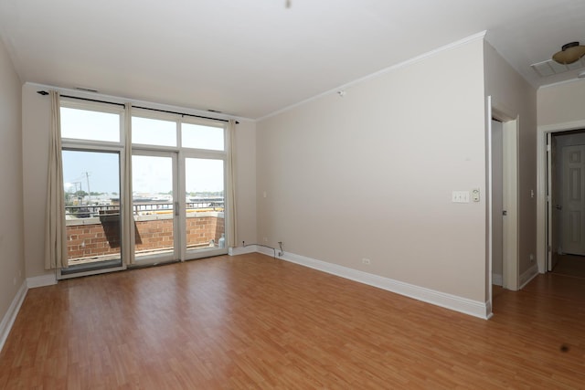 4330 N Neva Ave Unit 411, Norridge, IL 60706 - spare room with light wood-style flooring and ornamental molding