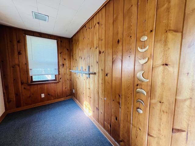 506 Scribner St, Joliet, IL 60432 - carpeted empty room featuring baseboards and wood walls