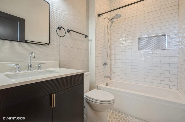 456 E Oakwood Blvd Unit 3, Chicago, IL 60653 - bathroom featuring toilet, vanity, shower / bathtub combination, and tile walls