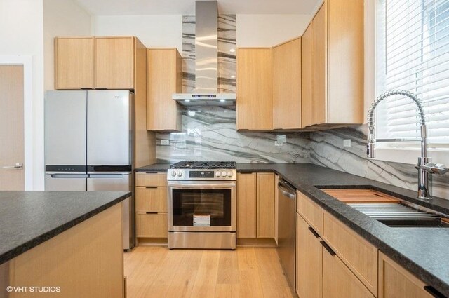 456 E Oakwood Blvd Unit 3, Chicago, IL 60653 - kitchen featuring wall chimney range hood, appliances with stainless steel finishes, light brown cabinets, and a sink