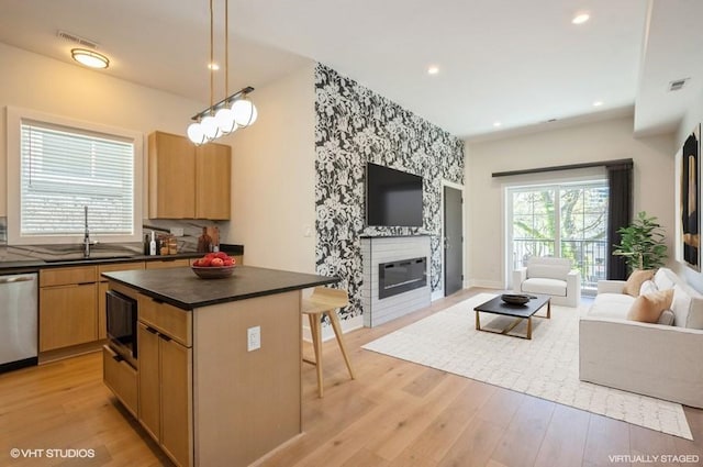 456 E Oakwood Blvd Unit 3, Chicago, IL 60653 - kitchen featuring a sink, open floor plan, stainless steel dishwasher, dark countertops, and recessed lighting