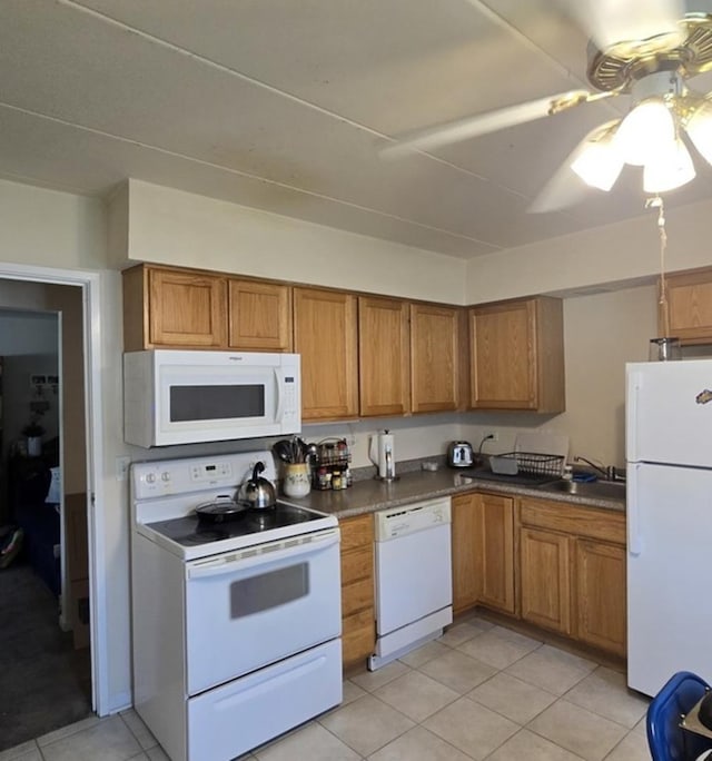 12850 Crestbrook Ct Unit 3, Crestwood, IL 60418 - kitchen with white appliances, brown cabinetry, light tile patterned floors, and dark countertops