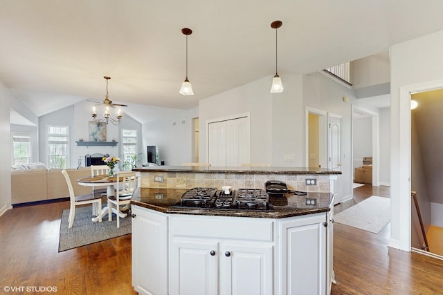 3432 Redwing Dr, Naperville, IL 60564 - kitchen featuring black gas cooktop, dark wood finished floors, open floor plan, and lofted ceiling
