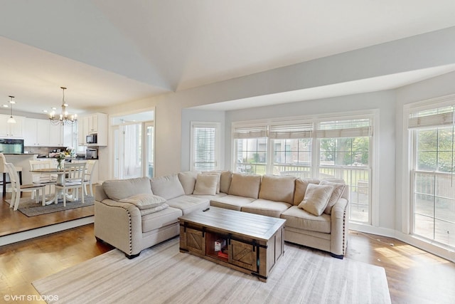 3432 Redwing Dr, Naperville, IL 60564 - living room with a chandelier and light wood-style flooring