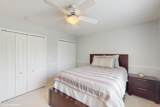 3432 Redwing Dr, Naperville, IL 60564 - bedroom featuring multiple closets, light carpet, and a ceiling fan