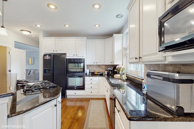 3432 Redwing Dr, Naperville, IL 60564 - kitchen with black appliances, wood finished floors, white cabinets, pendant lighting, and recessed lighting
