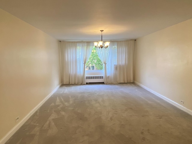 2834 W Granville Ave Unit 2A, Chicago, IL 60659 - carpeted empty room with radiator heating unit, a chandelier, and baseboards