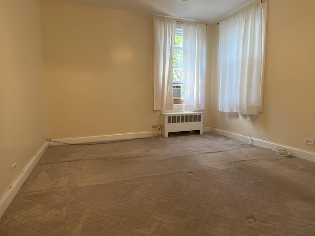 2834 W Granville Ave Unit 2A, Chicago, IL 60659 - spare room featuring radiator, baseboards, and carpet floors