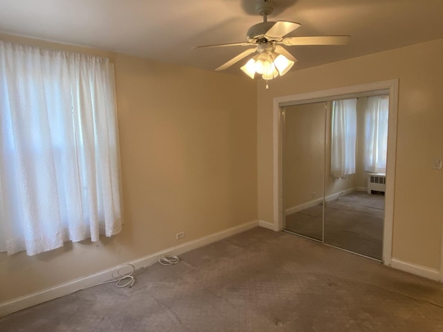 2834 W Granville Ave Unit 2A, Chicago, IL 60659 - unfurnished bedroom featuring radiator, a closet, baseboards, and carpet