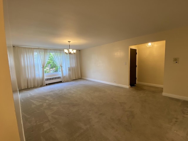 2834 W Granville Ave Unit 2A, Chicago, IL 60659 - spare room featuring radiator heating unit, a chandelier, carpet, and baseboards