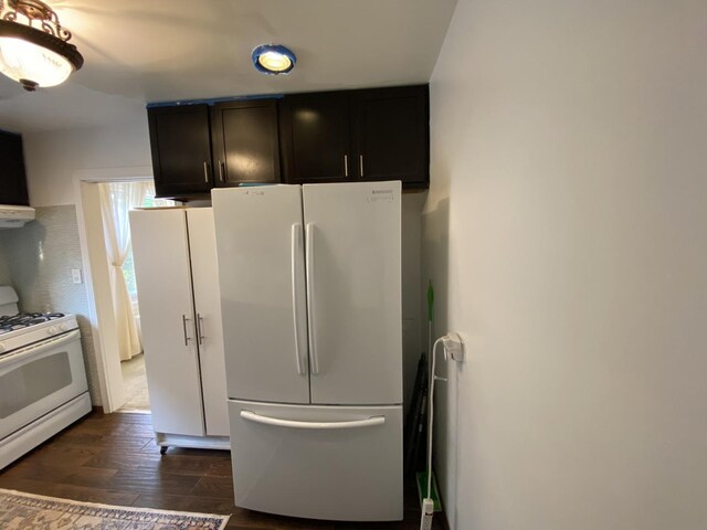 2834 W Granville Ave Unit 2A, Chicago, IL 60659 - kitchen featuring white appliances, dark wood-style floors, and exhaust hood