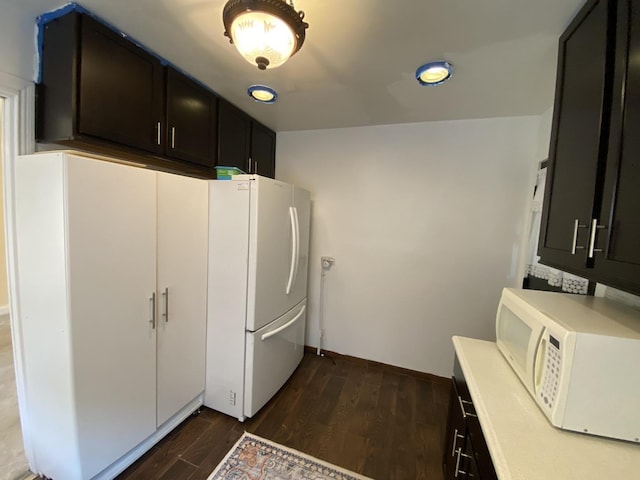 2834 W Granville Ave Unit 2A, Chicago, IL 60659 - kitchen featuring white appliances, dark wood-style floors, light countertops, recessed lighting, and baseboards