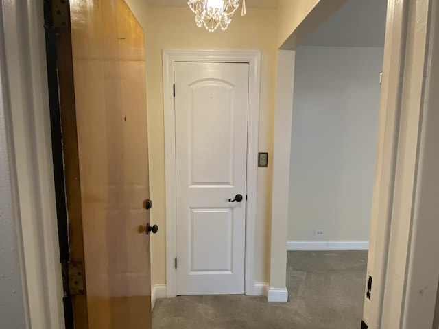 2834 W Granville Ave Unit 2A, Chicago, IL 60659 - hallway with carpet floors, a chandelier, and baseboards