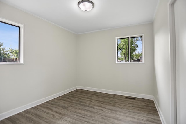 463 Tahoe St, Park Forest, IL 60466 - empty room featuring healthy amount of natural light, crown molding, and dark wood-style flooring