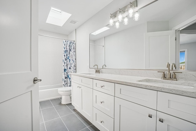 4951 W Ribbon Dr, Monee, IL 60449 - full bathroom featuring a skylight, double vanity, tile patterned flooring, and shower / bath combo