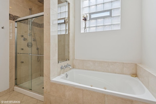 3020 N Sheffield Ave Unit 1N, Chicago, IL 60657 - bathroom featuring a stall shower, a whirlpool tub, and tile patterned flooring