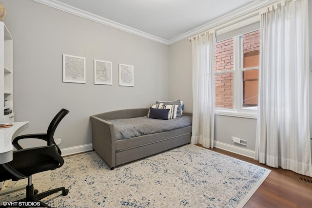 3020 N Sheffield Ave Unit 1N, Chicago, IL 60657 - bedroom featuring crown molding, wood finished floors, and a desk