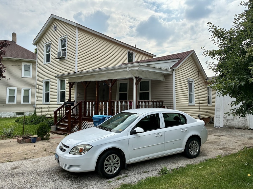 160 N Root St, Aurora, IL 60505 - view of front of house featuring covered porch and cooling unit