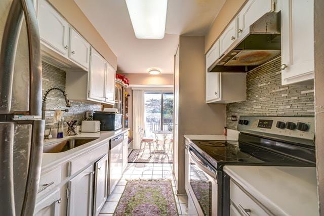 600 Naples Ct Unit 107, Glenview, IL 60025 - kitchen featuring stainless steel appliances, exhaust hood, a sink, and tasteful backsplash