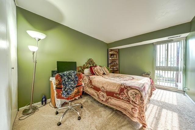 600 Naples Ct Unit 107, Glenview, IL 60025 - bedroom featuring carpet floors and lofted ceiling
