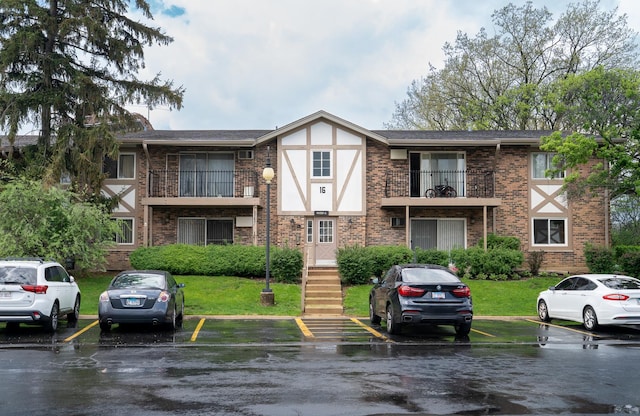 9S220 Lake Dr Unit 16-201, Willowbrook, IL 60527 - view of building exterior featuring uncovered parking