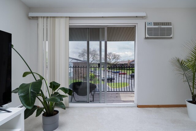 9S220 Lake Dr Unit 16-201, Willowbrook, IL 60527 - interior space featuring an AC wall unit, carpet floors, and baseboards