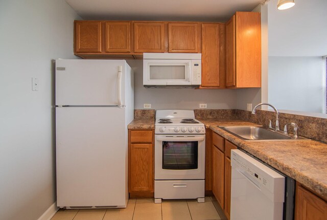 345 E Eastgate Pl Unit 505, Chicago, IL 60616 - kitchen with white appliances, a sink, brown cabinets, and light tile patterned floors