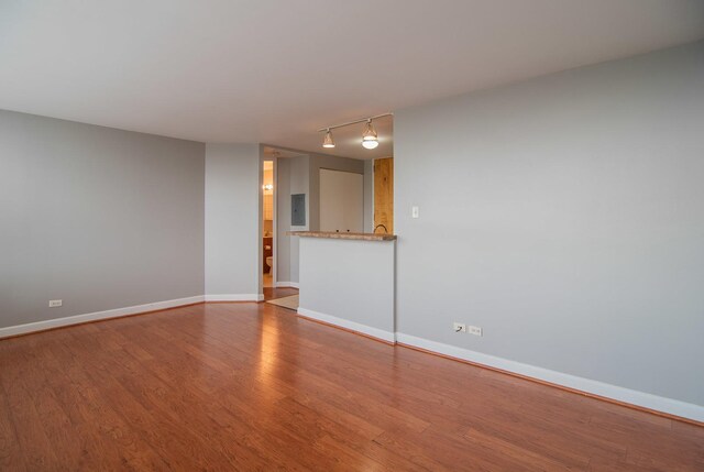 345 E Eastgate Pl Unit 505, Chicago, IL 60616 - unfurnished room with rail lighting, wood finished floors, and electric panel