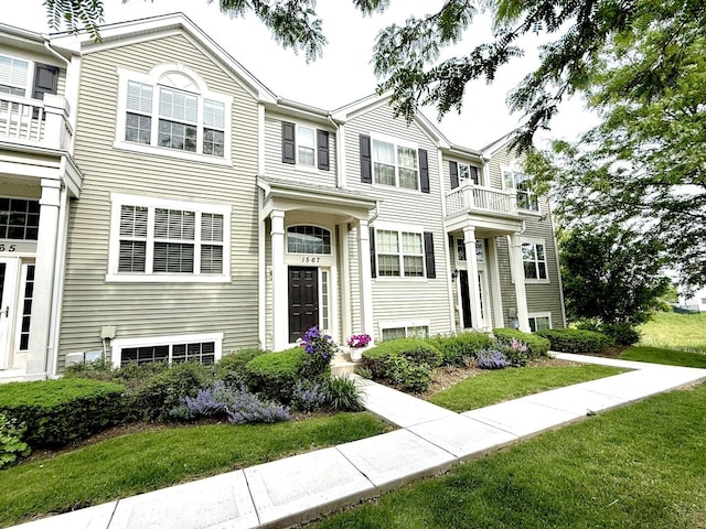 1567 Windward Dr, Pingree Grove, IL 60140 - view of property featuring a front lawn and a balcony