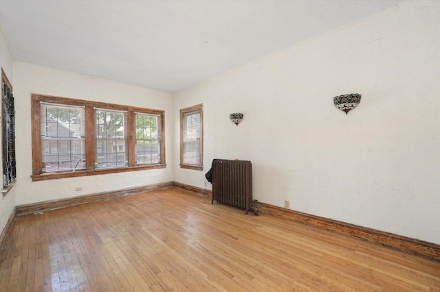 6116 S Marshfield Ave, Chicago, IL 60636 - unfurnished room with radiator, baseboards, and light wood finished floors
