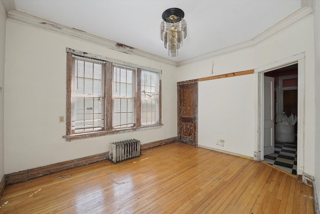 6116 S Marshfield Ave, Chicago, IL 60636 - empty room featuring radiator heating unit, ornamental molding, light wood-type flooring, and baseboards