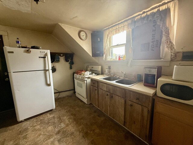 2326 Walnut St, Blue Island, IL 60406 - kitchen with white appliances, a sink, light countertops, brown cabinetry, and stone finish flooring