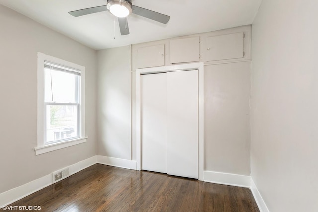 3000 Chicago Rd, South Chicago Heights, IL 60411 - unfurnished bedroom with dark wood finished floors, baseboards, a closet, and ceiling fan