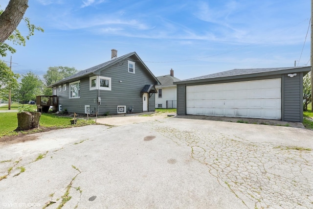 3000 Chicago Rd, South Chicago Heights, IL 60411 - view of side of property with a garage, an outbuilding, and a chimney