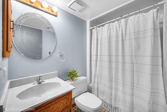 8124 168th Pl Unit 1E, Tinley Park, IL 60477 - full bathroom featuring vanity, toilet, and a shower with curtain