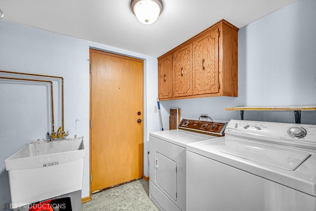 8124 168th Pl Unit 1E, Tinley Park, IL 60477 - laundry area featuring separate washer and dryer, cabinet space, and light flooring
