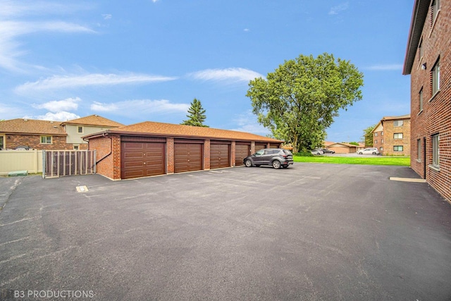 8124 168th Pl Unit 1E, Tinley Park, IL 60477 - garage featuring a residential view